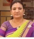 A person in a colorful sari

Description automatically generated